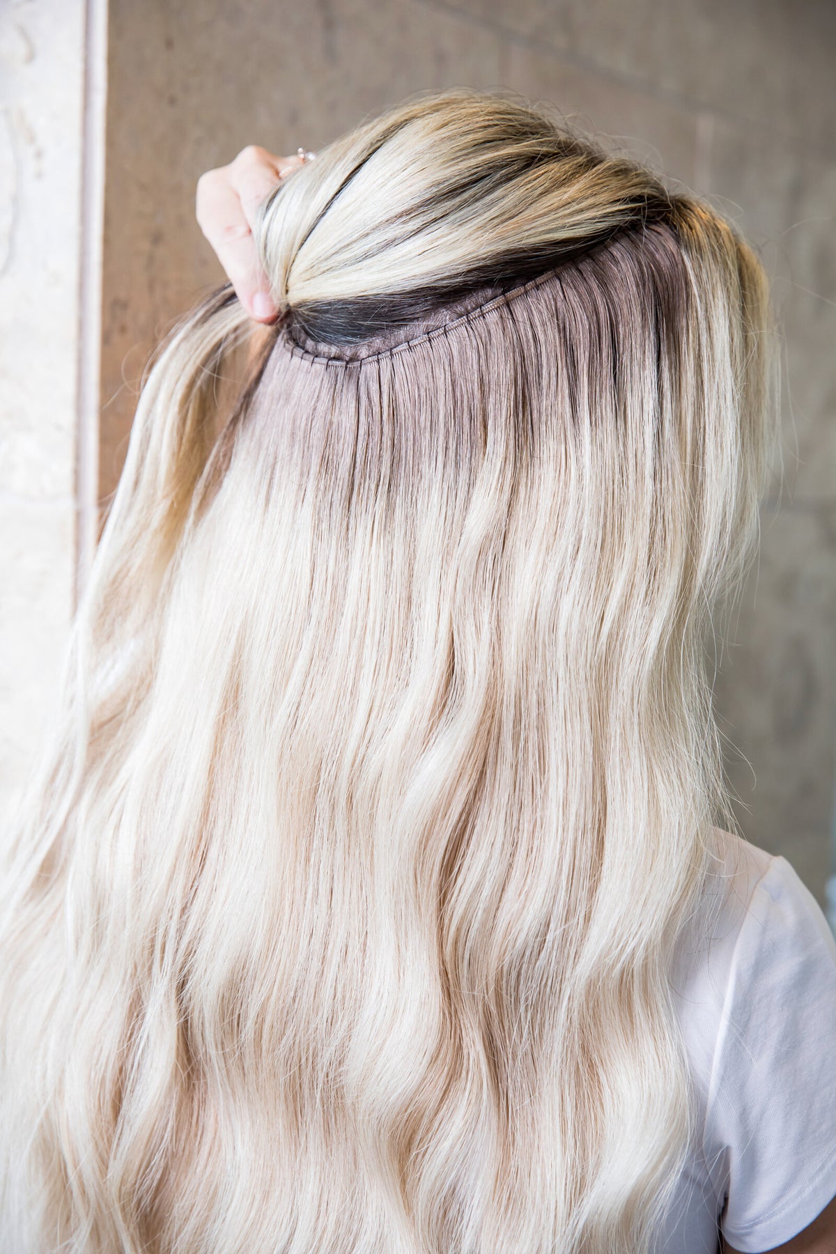 @that_blonde_stylist is wearing a blend of London, Manhattan and Berlin Euro Genius Wefts