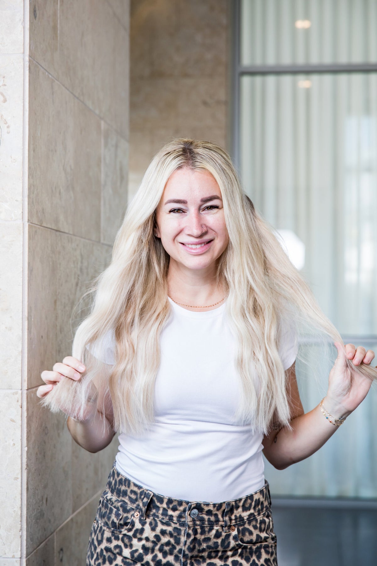@that_blonde_stylist is wearing a blend of London, Manhattan and Berlin Euro Genius Wefts